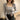 Women's gray ribbed knit top with a square neckline and long sleeves, styled as outerwear.