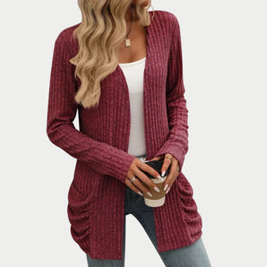 Burgundy ribbed women's long sleeve open front cardigan in red, shown in size 2XL, worn over jeans. The cardigan features a cozy knit texture, with visible sleeves and a flattering fit around the neck and waist.