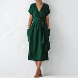 Burgundy V-neck wrap linen midi dress featuring a flattering silhouette with pockets, shown in a standing pose.