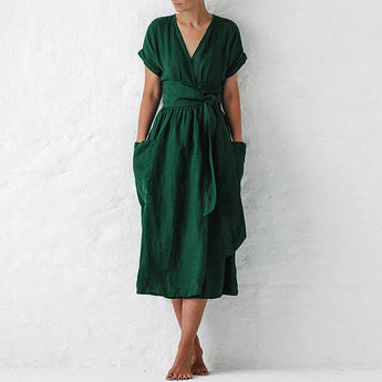 Burgundy V-neck wrap linen midi dress featuring a flattering silhouette with pockets, shown in a standing pose.