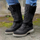 Burgundy women's combat boots with chunky soles and quilted panels, displayed on a grassy surface.