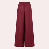 Burgundy women's high-waisted wide-leg palazzo pants with a smooth, flowing fabric and rich color, ideal for a stylish and comfortable look.