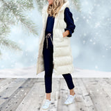 Burgundy women's long puffer coat with detachable hood, featuring full sleeves and knee-length design, modeled in a natural outdoor setting.