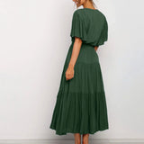 Burnt orange midi dress featuring a ruffle skirt and flutter sleeves, showcasing a stylish fashion design suitable for formal wear.