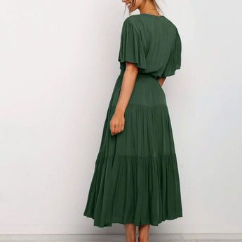 Burnt orange midi dress featuring a ruffle skirt and flutter sleeves, showcasing a stylish fashion design suitable for formal wear.
