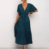 Dark green midi dress featuring a ruffle skirt and flutter sleeves, designed as a one-piece garment with a focus on shoulder, arm, and waist detailing, ideal for day wear. Suitable for size 2XL.
