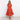 Burnt orange midi dress featuring a ruffle skirt and flutter sleeves, designed with a fitted waist and knee-length cut, suitable for day or formal wear.