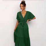 Burnt orange midi dress featuring a ruffle skirt and flutter sleeves, shown in grass green, size 2XL, worn by a model.