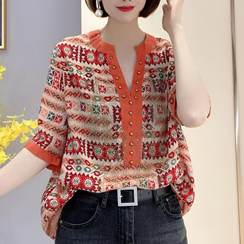 
A red, butterfly print bohemian V-neck batwing blouse for women in 4XL size, featuring wide sleeves and a loose, comfortable fit.