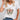 White V-neck T-shirt with butterfly print modeled by a woman, showcasing the casual summer top in size 3XL. The focus is on the upper body, highlighting the neckline and short sleeves.