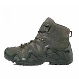Olive green camouflage tactical hiking boots featuring military style design with high ankle support, suitable for outdoor activities and rugged terrains.