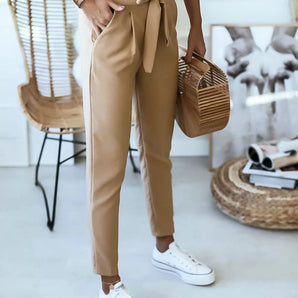 Caramel tie-waist paperbag trousers featuring a casual chic design with a comfortable fit, showcasing a beige color with a focus on the waist area.