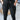 
A woman wearing black tie-waist paperbag trousers, designed with a casual chic comfort fit, emphasizing the waist and a relaxed thigh area.