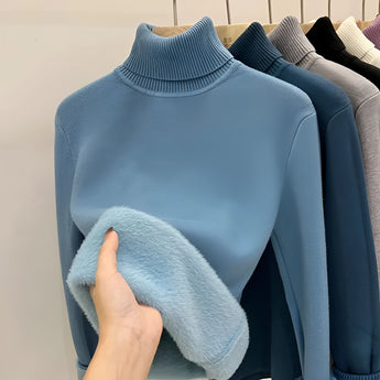 Luxury cashmere turtleneck sweater in a soft azure tone, featuring long sleeves and a cozy neckline, ideal for winter wear.