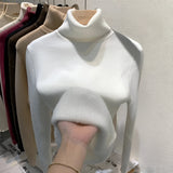 Luxurious white cashmere turtleneck sweater displayed on a mannequin, showcasing its soft texture and elegant fashion design. The sweater features long sleeves, a high neck, and is styled as an XL size outerwear piece.