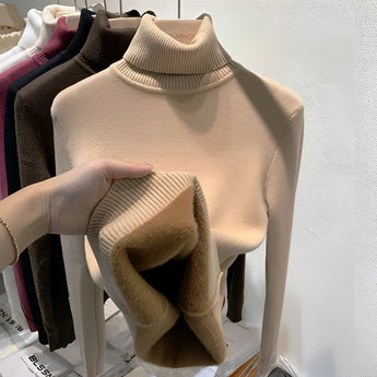 Cashmere turtleneck sweater in a soft grey color displayed on a mannequin, showcasing its luxurious texture and elegant design with a high collar, long sleeves, and fitted waist, available in size XL.