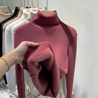 Cashmere turtleneck sweater in rosewood color, showcasing its soft texture and luxurious design, with detailed features like a high collar, long sleeves, and fashion-forward silhouette.