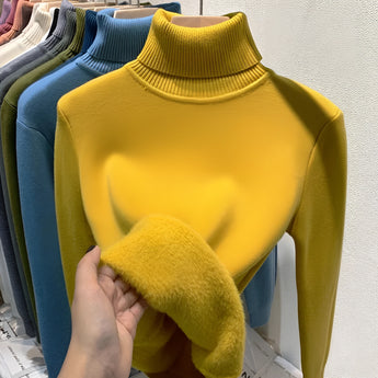 Yellow cashmere turtleneck sweater displayed on a mannequin, featuring a soft touch and luxurious appearance, with long sleeves and a fitted design suitable for winter wear.