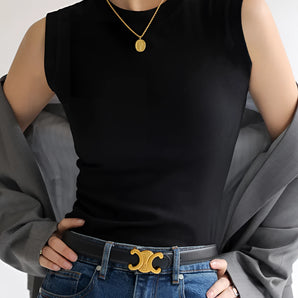 Casual Chic Women's Fashion outfit featuring a black sleeveless top, moon belt, and denim jeans, worn by a model in size XL.