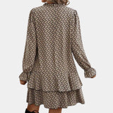 Chain-link print long sleeve blouse for women featuring a geometric pattern, with a focus on the shoulder and neck area.