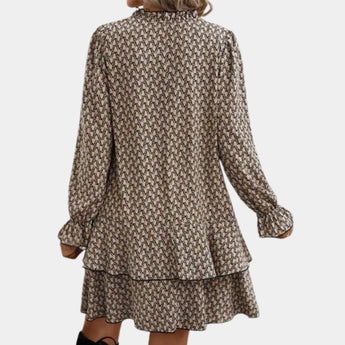 Chain-link print long sleeve blouse for women featuring a geometric pattern, with a focus on the shoulder and neck area.