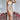 
A champagne satin cowl neck silk evening gown, featuring a backless design and maxi length. The dress is styled with a sheath silhouette, highlighting elegant fashion details such as a seamless flow and delicate draping. The garment is showcased in a 2XL size.