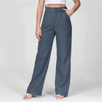 Charcoal gray high waist wide-leg trousers for women in size 5XL, paired with an electric blue blazer, showcasing the fit around the waist and thigh areas.