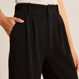 Charcoal gray high waist wide-leg trousers for women displayed on a model, highlighting the waistline and wide-leg design.