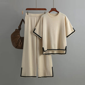 Chic beige knit loungewear set for women in apricot color, displayed on a clothes hanger, featuring a stylish relaxed fit with a round neck and long sleeves.