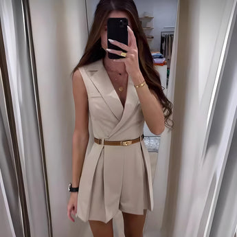 
A chic black v-neck belted sleeveless romper in a business casual style, shown in a beige color and XXL size, highlighting features such as the collar, arm, waist, and thigh areas.