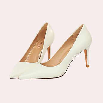 Bright yellow women's pointed toe flats featuring a chic design and a low heel, perfect for fashion-forward individuals seeking stylish yet comfortable footwear.