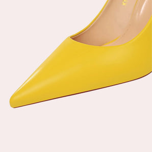 Stylish bright yellow women's pointed toe flats featuring a sleek design with a chic rectangular metal accent.