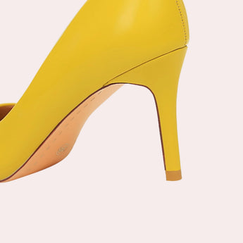 Bright yellow women's pointed toe flats displayed, showcasing a chic and fashionable design, perfect for adding a pop of color to any outfit.