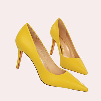 Chic bright yellow women's pointed toe flats and pumps in size 42, displayed on a wooden surface, highlighting their sleek design and vibrant color.