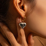 Chic Two-Tone Heart Hoop Earrings - Romantic Valentine's Jewelry displayed on a model's ear.