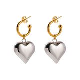 Two-tone heart hoop earrings in gold and silver, perfect for Valentine's Day, featuring romantic and elegant design.