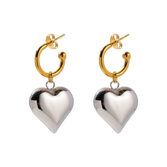 Two-tone heart hoop earrings in gold and silver, perfect for Valentine's Day, featuring romantic and elegant design.