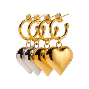 Two-tone heart-shaped hoop earrings made of gold, showcasing a romantic and elegant design perfect for Valentine's Day.
