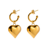Chic two-tone heart hoop earrings in gold and silver, romantic Valentine's jewelry displayed against a white background.