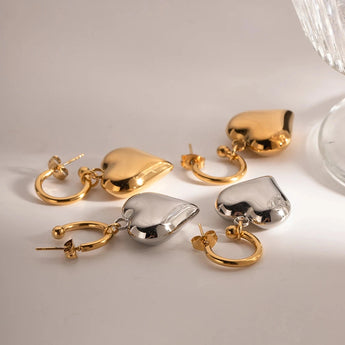 Chic two-tone heart hoop earrings featuring a blend of gold and silver metal, perfect for Romantic Valentine's Jewelry.