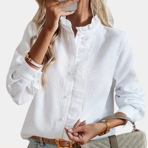 White long sleeve ruffle button-up blouse with collar and stylish design, showcasing elegant details for a chic look.