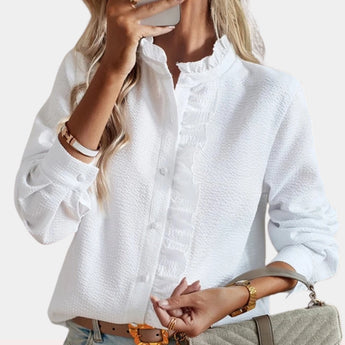 White long sleeve ruffle button-up blouse with collar and stylish design, showcasing elegant details for a chic look.