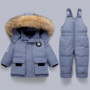 Children's blue insulated snowsuit set featuring a waterproof jacket with a fur-trimmed hood and matching bibs, designed for cold weather with grey detailing.