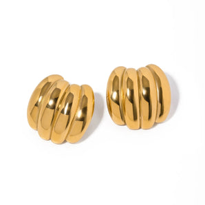 Chunky 18K gold plated dome earrings, bold statement fashion jewelry, displayed on a wooden surface.