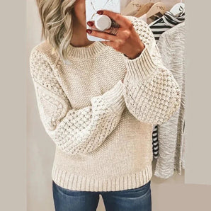 White chunky cream cable knit sweater for women, showcasing cozy winter fashion with detailed stitching on the sleeves and shoulders, featuring a high neck and relaxed fit in size XL.