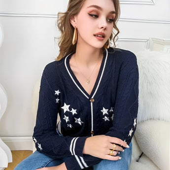 Chunky knit cardigan worn by a woman, showcasing a casual chic spring fashion style, focusing on the shoulder and sleeve details.