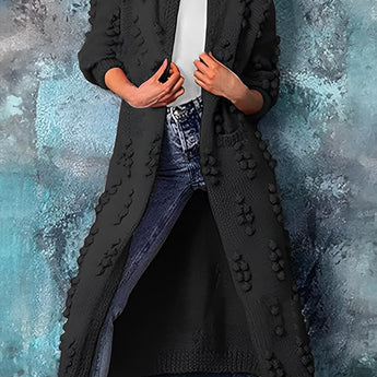 Chunky Knit Cardigan in Nero color, women's bobble sleeve sweater coat, size 3XL, featuring a textured design with a collar and waist-length style, photographed in a fashion setting with flash photography.