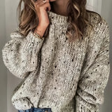 Chunky knit crew neck wool sweater in textured speckled brown, featuring long sleeves and a comfortable fit, modeled in a gray color and size 2XL.