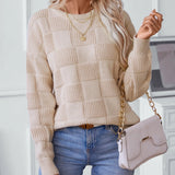 Chunky knit textured beige sweater for women, featuring long sleeves and a high neckline, showcasing a cozy autumn fashion look.