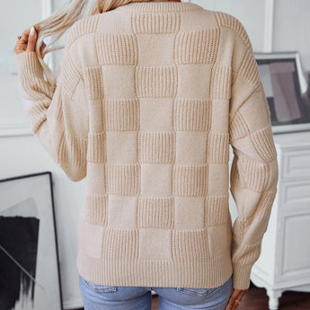 Chunky knit textured beige sweater for women, showcasing the autumn fashion style, featuring long sleeves and a cozy neckline.